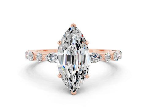 Rose gold Marquise Cut Moissanite Solitaire with Side Stones on a Pavé Band and Four-Prong Setting