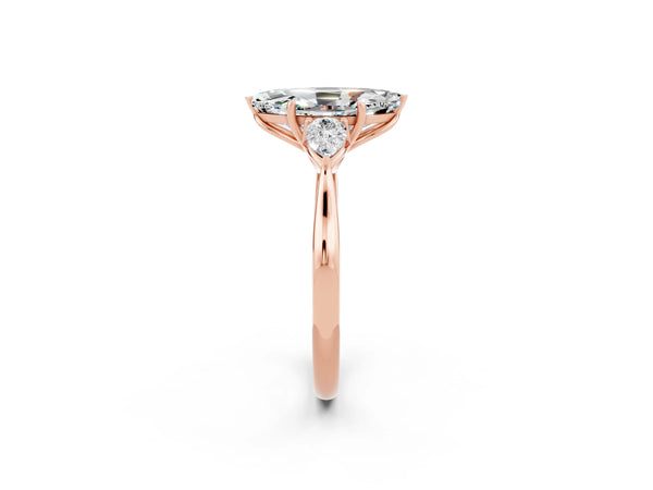 Rose gold Marquise Cut Moissanite Three-Stone Ring with Pear  Side Stones and Prong Setting