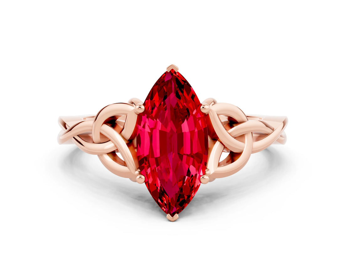 Rose gold Marquise Cut Ruby Solitaire Engagement Ring with Celtic Knot Band and Four-Prong Setting