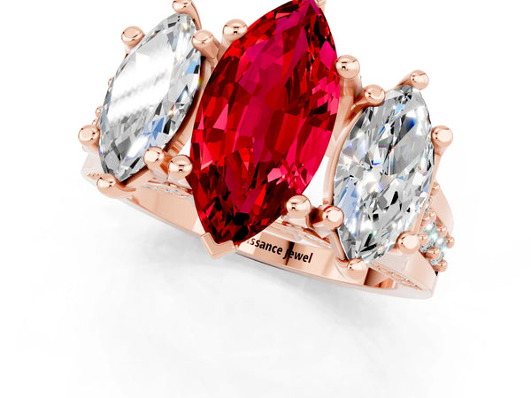 Rose gold Marquise Cut Ruby Three-Stone Ring with Channel Set Band and Four-Prong Setting