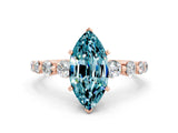Rose gold Marquise Cut Solitaire Blue Topaz Ring with Pave Band and Four-Prong Setting