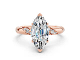 Rose gold Marquise Cut Solitaire Diamond Engagement Ring with Twisted Pave Band and Four-Prong Setting