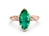 Rose gold Marquise Cut Solitaire Diamond Engagement Ring with Twisted Pave Band and Four-Prong Setting