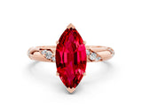 Rose gold Marquise Cut Solitaire Diamond Engagement Ring with Twisted Pave Band and Four-Prong Setting
