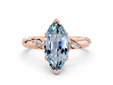 Rose gold Marquise Cut Solitaire Diamond Engagement Ring with Twisted Pave Band and Four-Prong Setting