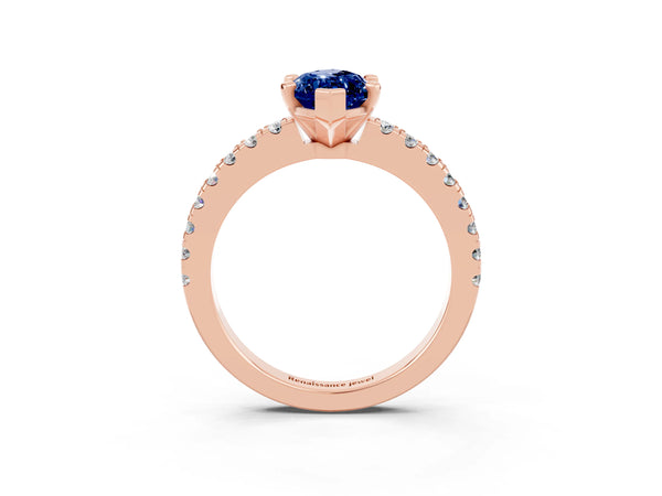 Rose gold Marquise Cut Solitaire Blue Sapphire with Pavé Band and Four-Prong Setting