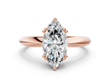 Rose gold Marquise Cut Solitaire Engagement Ring with Tapered Band and Four-Prong Setting