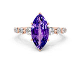 Rose gold Marquise Cut Solitaire Tanzanite Ring with Pave Band and Four-Prong Setting