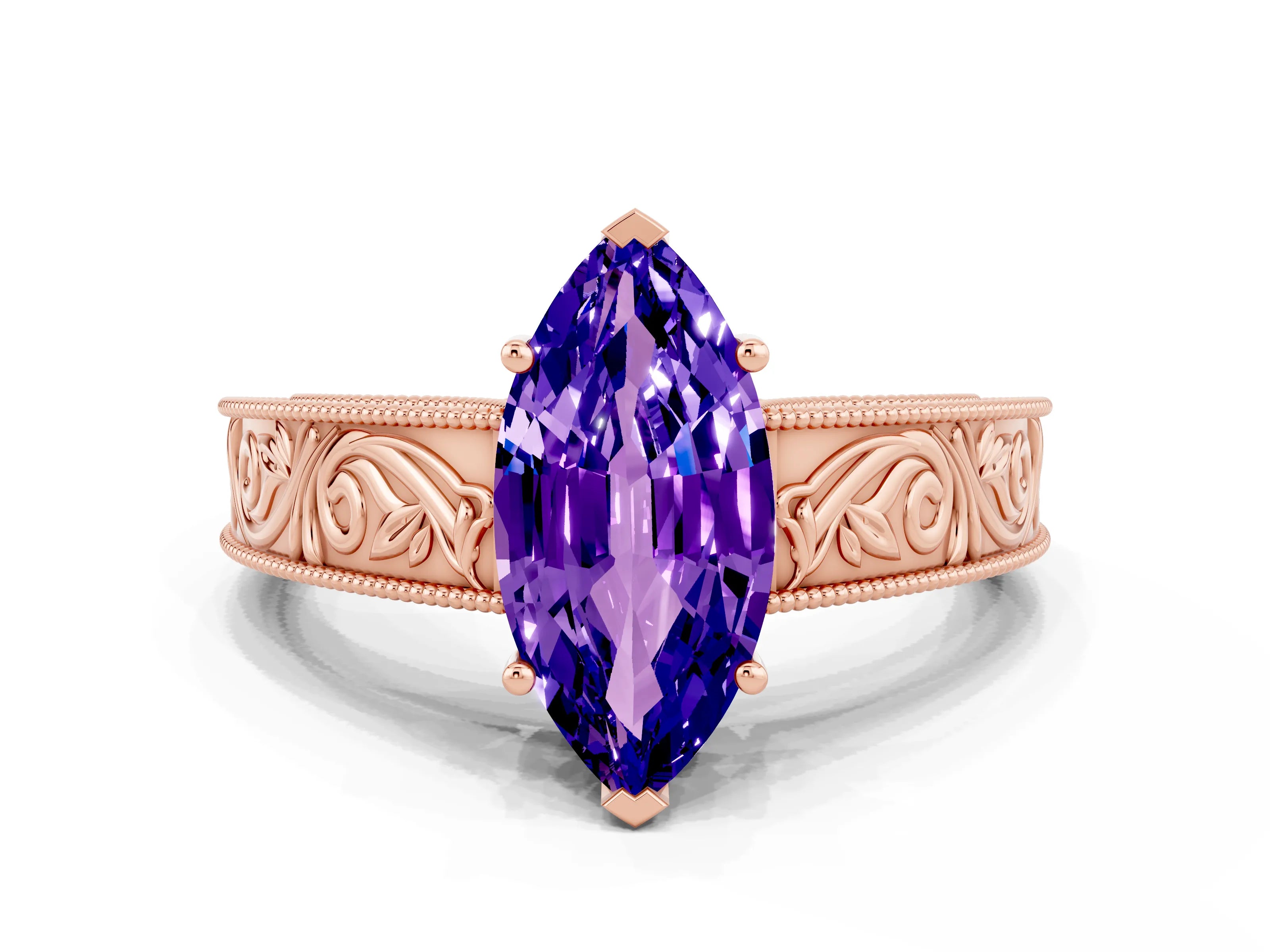 Rose gold Marquise Cut Tanzanite Solitaire Ring with Engraved Band and Four-Prong Setting