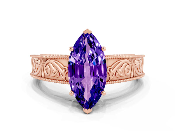 Rose gold Marquise Cut Tanzanite Solitaire Ring with Engraved Band and Four-Prong Setting