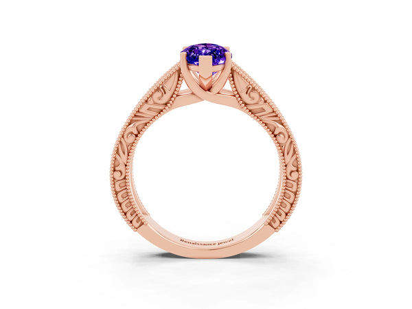 Rose gold Marquise Cut Tanzanite Solitaire Ring with Engraved Band and Four-Prong Setting