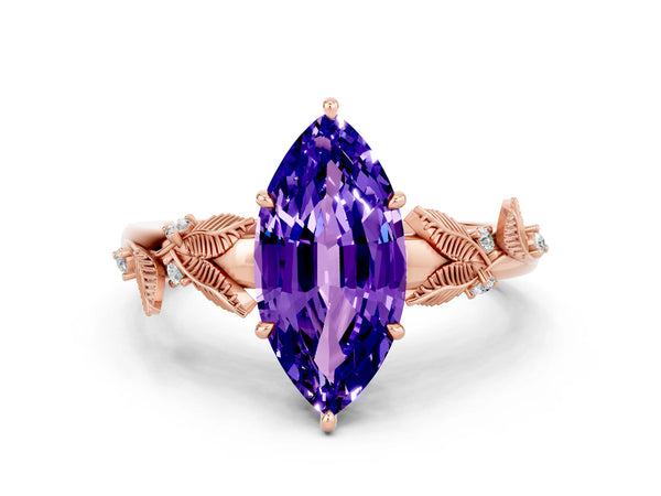 Rose gold Marquise Cut Tanzanite Solitaire Ring with Leaf Motif Band and Four-Prong Setting