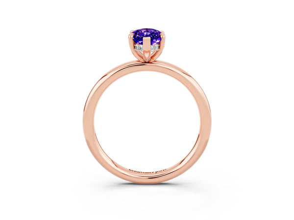 Rose gold Marquise Cut Tanzanite Solitaire Ring with Thin Band and Four-Prong Setting