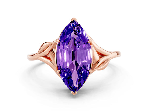 Rose gold Marquise Cut Tanzanite Solitaire Ring with Twist Band and Four-Prong Setting