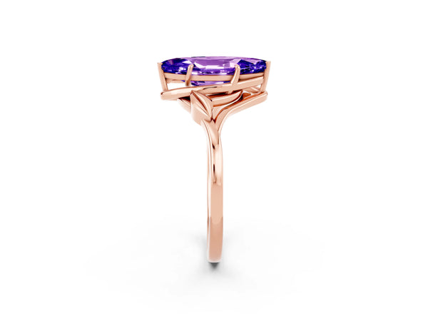 Rose gold Marquise Cut Tanzanite Solitaire Ring with Twist Band and Four-Prong Setting