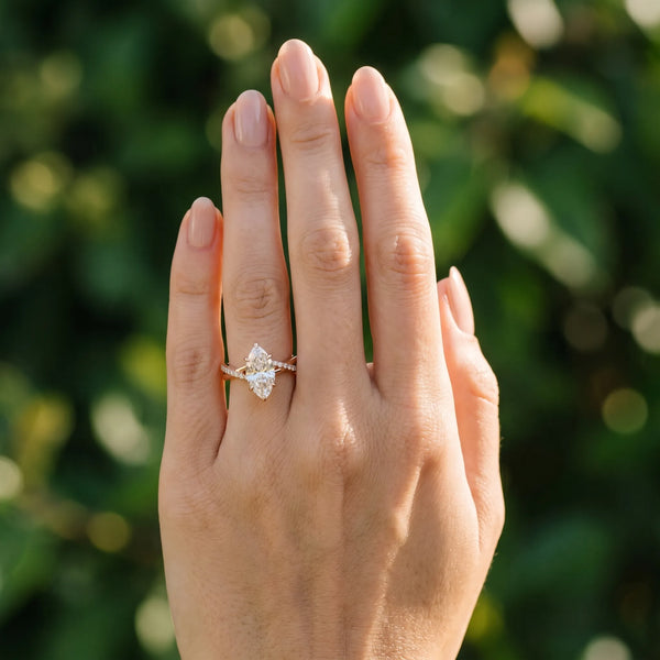 Rose gold Marquise Cut Twist Band Solitaire Diamond Ring with Pavé Setting