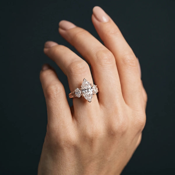 Rose gold Marquise Diamond Three-Stone Ring with Prong Setting and Textured Band