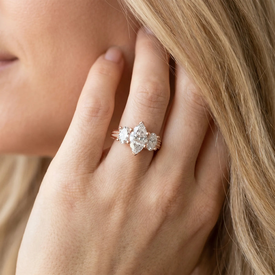 Rose gold Marquise Diamond Three-Stone Ring with Prong Setting and Textured Band
