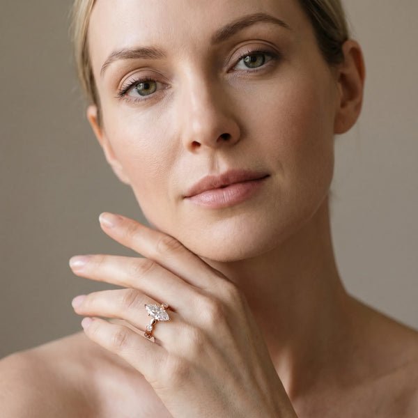 Rose gold Marquise Solitaire Bezel-Set Diamond Ring with Beaded Band and Four-Prong Setting