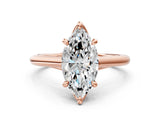 Rose gold Marquise Solitaire Engagement Ring with Six-Prong Setting and Classic Band