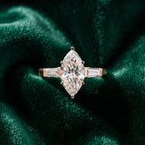 Rose gold Marquise Solitaire with Tapered Baguette Side Stones on a Classic Band with Four-Prong Setting_16