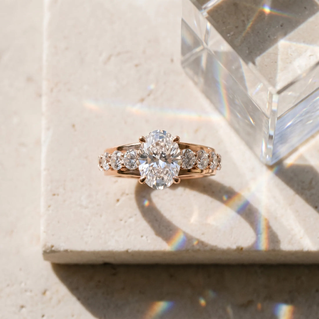 Rose gold Oval Brilliant Solitaire with Side Stones on a Pave Band and Four-Prong Setting_15