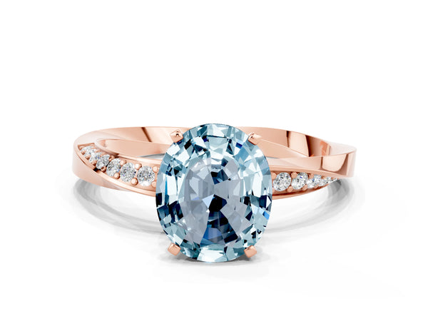 Rose gold Oval Cut Aquamarine Engagement Ring with Side Stone Accents and Four-Prong Setting