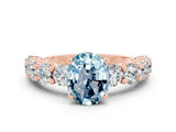 Rose gold Oval Cut Aquamarine Prong Setting with Side Stones on a Pave Band