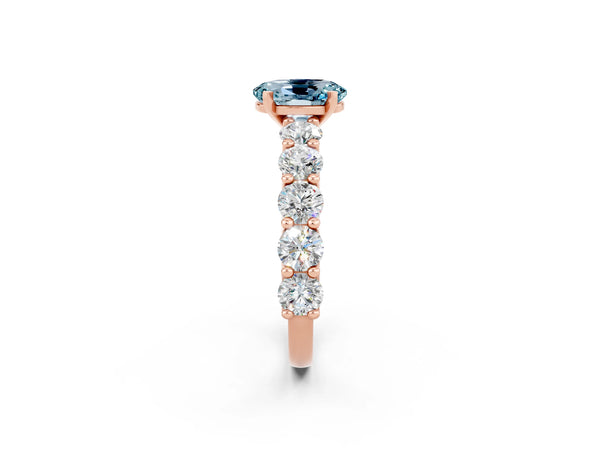 Rose gold Oval Cut Aquamarine Prong Setting with Side Stones on a Pave Band