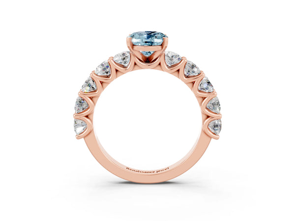 Rose gold Oval Cut Aquamarine Prong Setting with Side Stones on a Pave Band