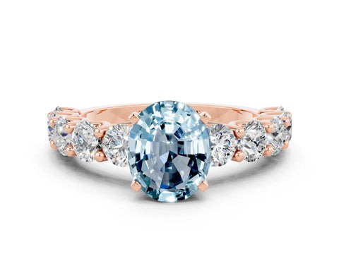Rose gold Oval Cut Aquamarine Prong Setting with Side Stones on a Pave Band