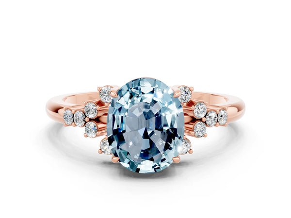 Rose gold Oval Cut Aquamarine Ring with Side Stones and Four-Prong Setting