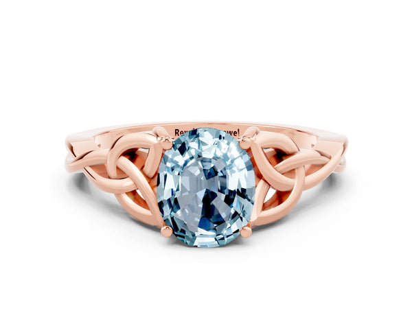 Rose gold Oval Cut Aquamarine Solitaire Engagement Ring with Celtic Knot Band and Four-Prong Setting
