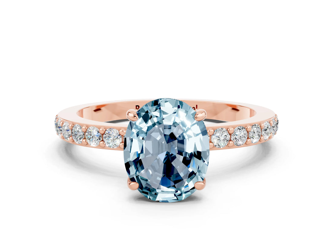 Rose gold Oval Cut Aquamarine Solitaire Engagement Ring with Pavé Band and Four-Prong Setting