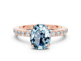 Rose gold Oval Cut Aquamarine Solitaire Engagement Ring with Pavé Band and Four-Prong Setting