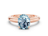 Rose gold Oval Cut Aquamarine Solitaire Engagement Ring with Round Band and Four-Prong Setting