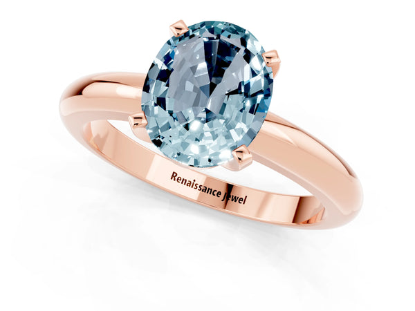 Rose gold Oval Cut Aquamarine Solitaire Engagement Ring with Round Band and Four-Prong Setting