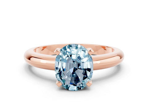 Rose gold Oval Cut Aquamarine Solitaire Engagement Ring with Round Band and Four-Prong Setting