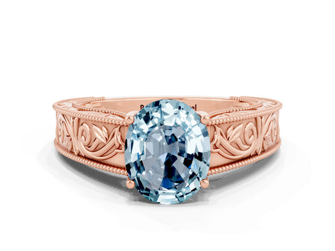 Rose gold Oval Cut Aquamarine Solitaire Ring with Engraved Band and Four-Prong Setting