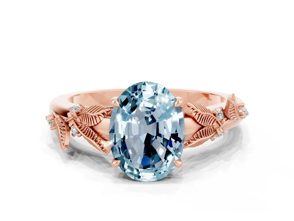 Rose gold Oval Cut Aquamarine Solitaire Ring with Leaf Motif Band and Four-Prong Setting
