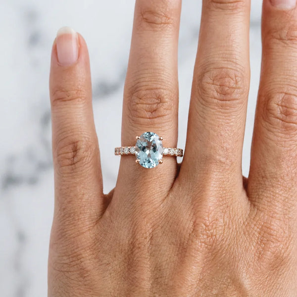Rose gold Oval Cut Aquamarine Solitaire Ring with Round  Pavé Band and Four-Prong Setting