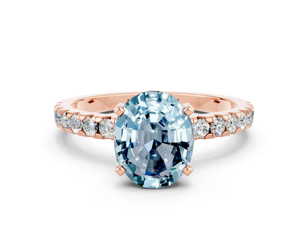 Rose gold Oval Cut Aquamarine Solitaire Ring with Round Pavé Band and Four-Prong Setting