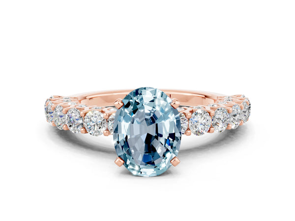 Rose gold Oval Cut Aquamarine Solitaire Ring with Shared Prong Pavé Band and Four-Prong Setting