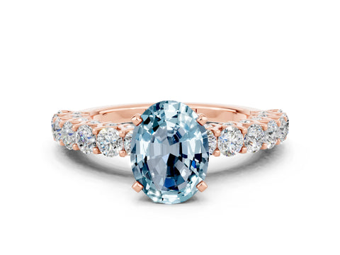 Rose gold Oval Cut Aquamarine Solitaire Ring with Shared Prong Pavé Band and Four-Prong Setting