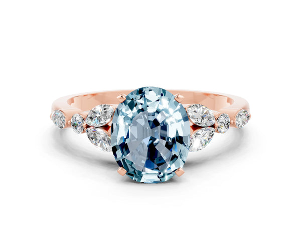 Rose gold Oval Cut Aquamarine Solitaire Ring with Side Stones and Four-Prong Setting