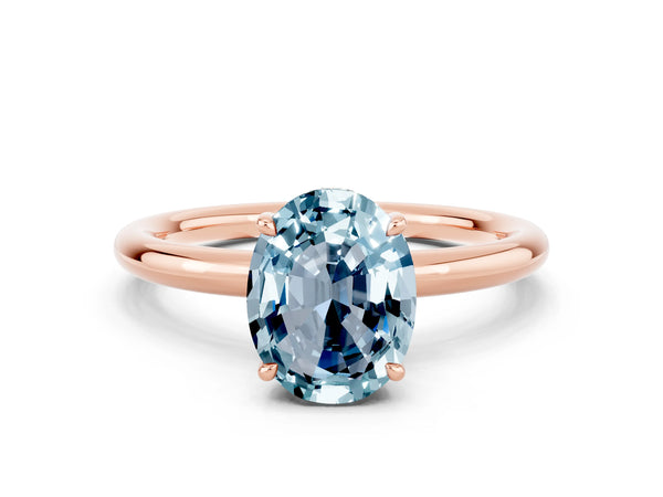Rose gold Oval Cut Aquamarine Solitaire Ring with Thin Band and Four-Prong Setting