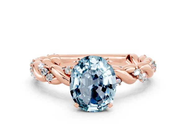 Rose gold Oval Cut Aquamarine Solitaire Ring with Twisted Band and Pavé Accents