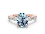 Rose gold Oval Cut Aquamarine Solitaire with Side Baguettes and Channel Set Band