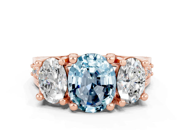 Rose gold Oval Cut Aquamarine Three-Stone Ring with Channel Set Band and Four-Prong Setting