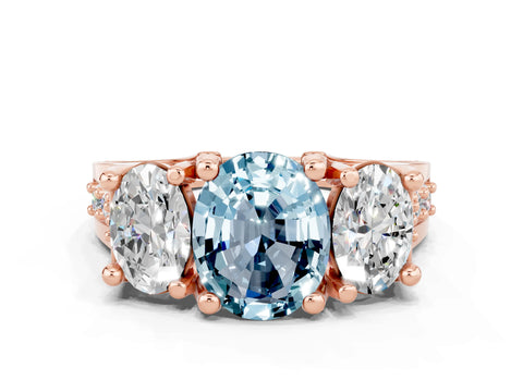 Rose gold Oval Cut Aquamarine Three-Stone Ring with Channel Set Band and Four-Prong Setting